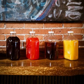 House-made juices lined up on the bar