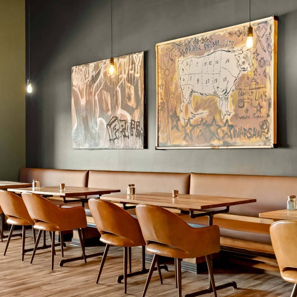 Dining room with leather banquette and custom artwork