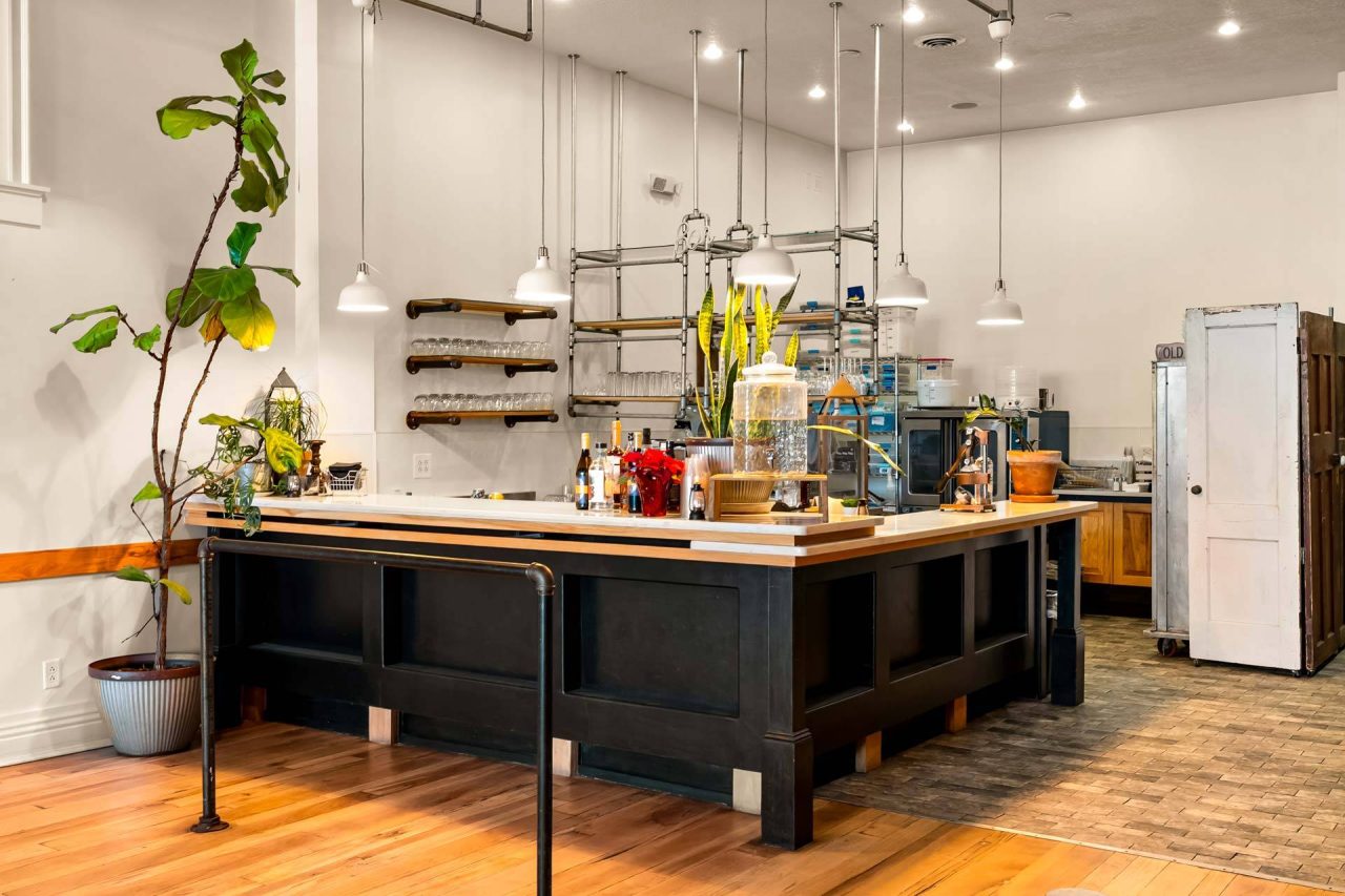 The Vic service bar with pendant lighting and fiddle-leaf fig