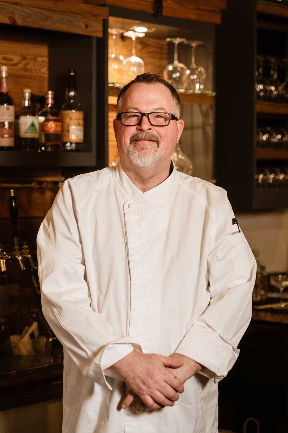 Executive chef portrait behind the bar