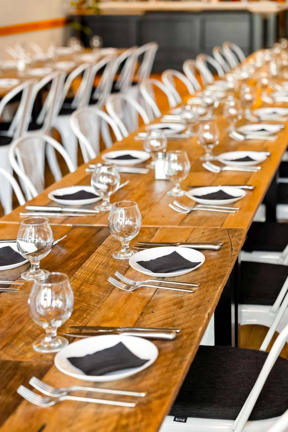 Long farm table place settings at The Vic
