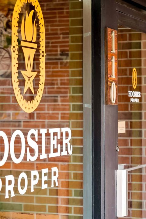 Hoosier Proper front door with torch emblem