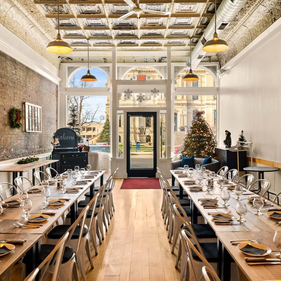 The Vic dining hall with tin ceiling and arched windows