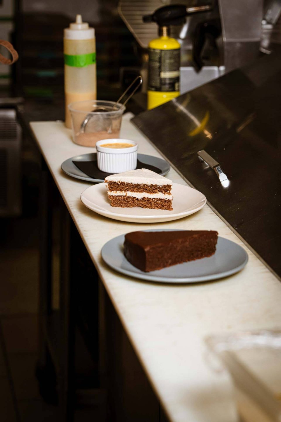 Dessert lineup with layered spice cake and flourless chocolate torte