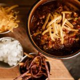 House chili with cheddar and crispy tortilla strips